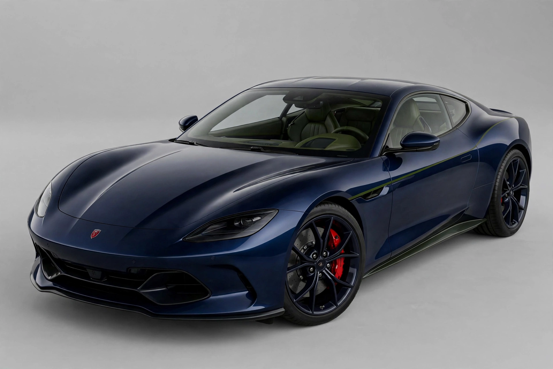 A deep navy sports coupe with a dark olive-green pinstripe and olive interior, a small red emblem on the nose and red brake calipers